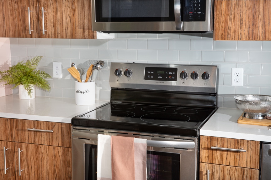 kitchen with close up of stainless steel stove at scout luxury fairfax apartments