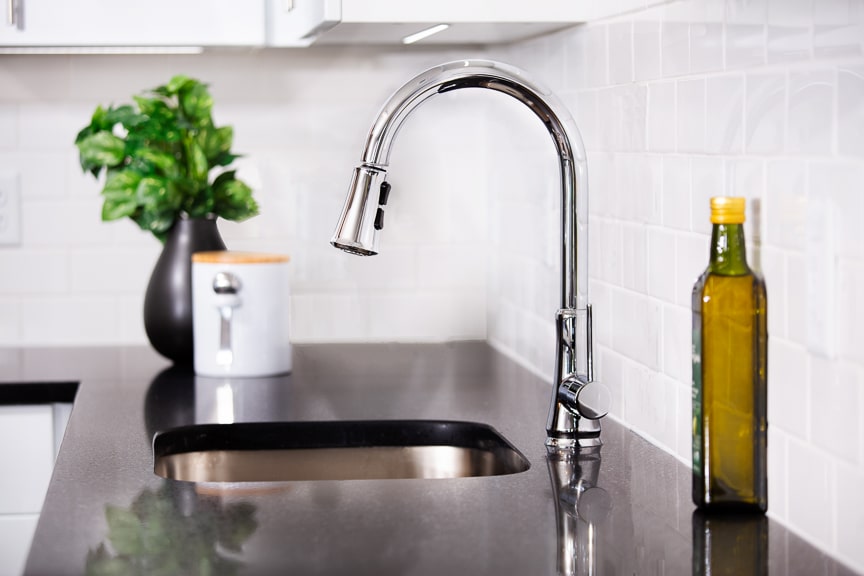 kitchen with close up of gooseneck faucet at scout luxury fairfax apartments