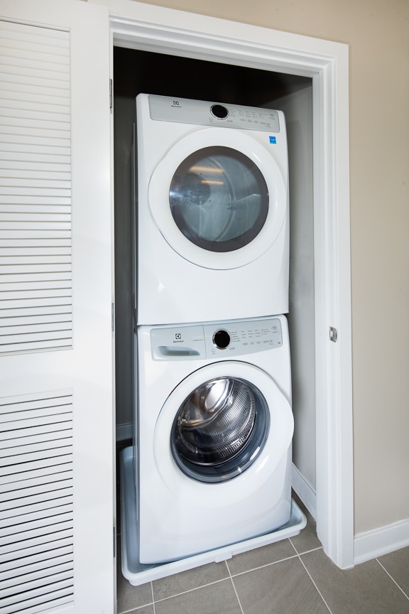 stackable washer dryer in apartment at scout luxury fairfax apartments