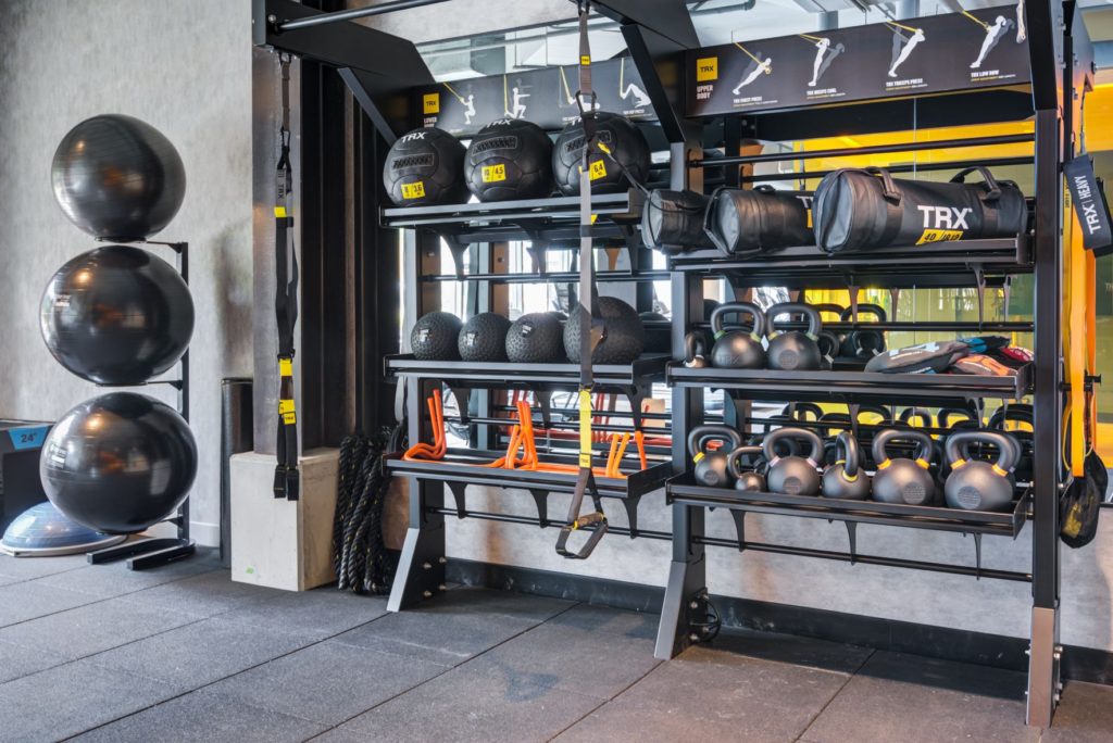 fitness center with kettlebells and exercise balls at scout luxury fairfax apartments