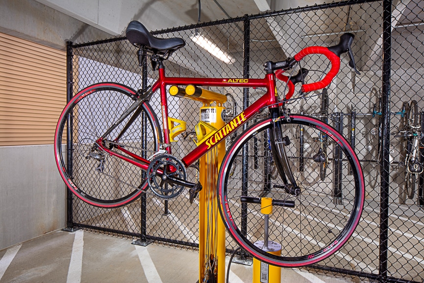 Bike hanging on a repair workstation at scout fairfax luxury apartments