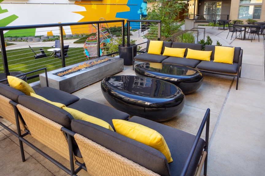 courtyard with social seating, firepit and views of balconies at scout on the circle luxury fairfax apartments